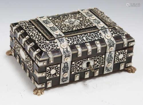 An early 20th century Indian ivory overlaid and horn workbox, with overall engraved and pierced