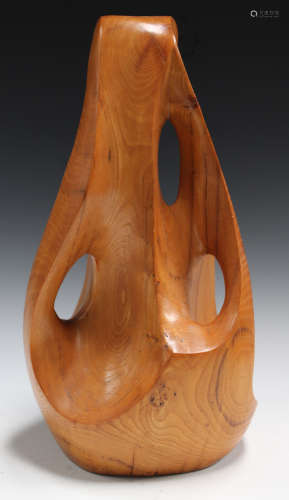 A 20th century carved softwood abstract sculpture of pierced and shaped form, height 44cm.Buyer’s