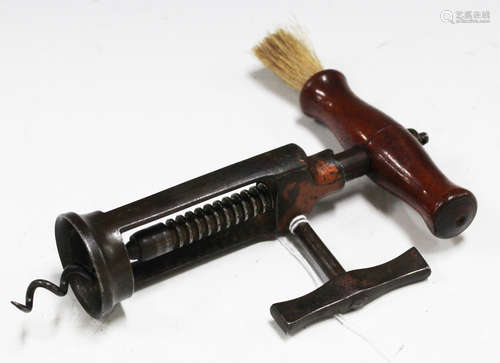 A 19th century open barrel corkscrew with remnants of copper finish, mahogany handle and side