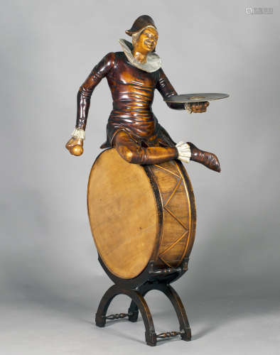 A late 19th century Italian carved and painted softwood figural dumb waiter, modelled in the form of