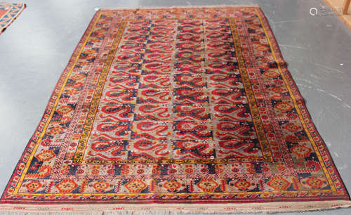 An Afghan Beshir design carpet, mid-20th century, the midnight blue field with overall bands of