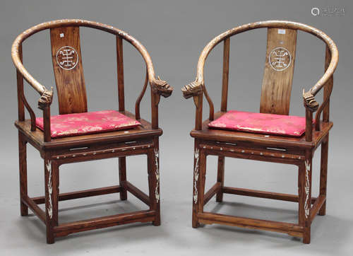 A pair of 20th century Chinese horseshoe back chairs with mother-of-pearl inlaid decoration and