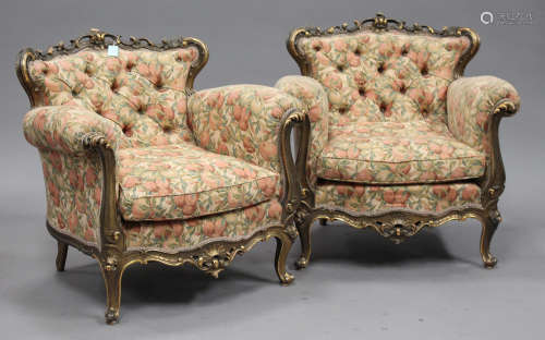 A pair of early/mid-20th century gilt showframe armchairs with green and gilt painted decoration, on
