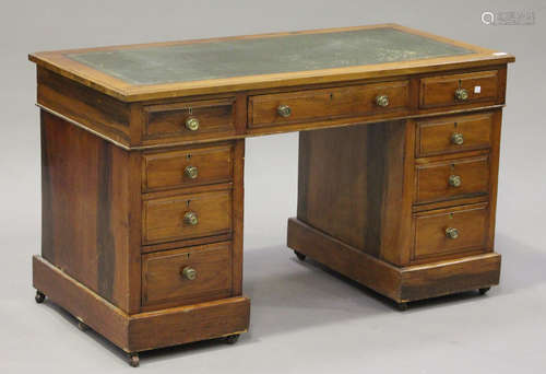 A Victorian walnut twin pedestal desk, fitted with nine drawers, on plinth bases, height 71cm, width