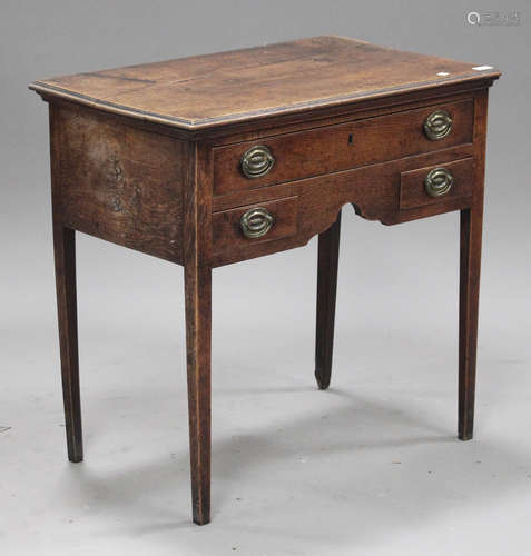 An 18th century oak lowboy, fitted with three drawers, on tapering block legs, height 76cm, width