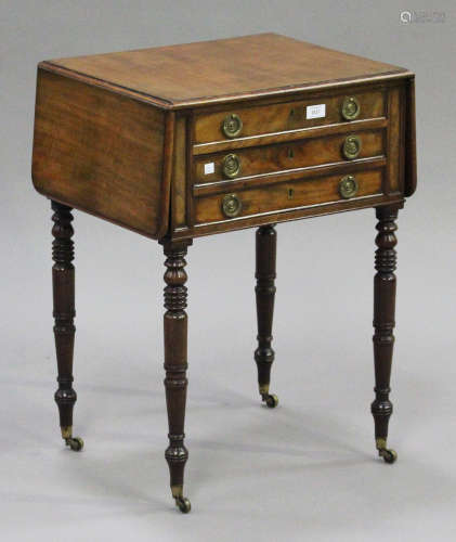 A Regency mahogany drop-flap work table, the top with a moulded edge above two drawers, on turned