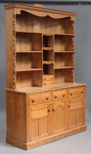 A modern ash and oak dresser, the shelf back above drawers and cupboards, on a plinth base, height