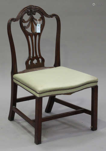 A George III Chippendale period mahogany dining chair, the pierced back carved with anthemion sprays