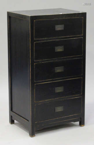 A 20th century ebonized sideboard, fitted with a central cupboard flanked by drawers, on block legs,