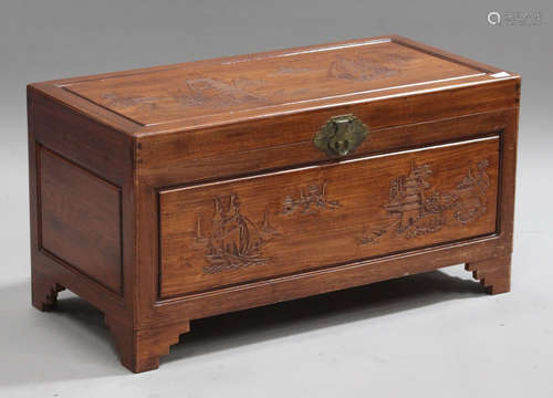 A 20th century Chinese camphor trunk with carved decoration, on bracket feet, height 49cm, width