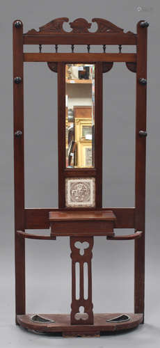 A late Victorian walnut hall stand with mirror and inset tile panel, height 195cm, width 83cm.