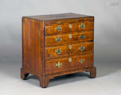 A George I walnut bachelor's chest with cross and feather banded decoration, fitted with a