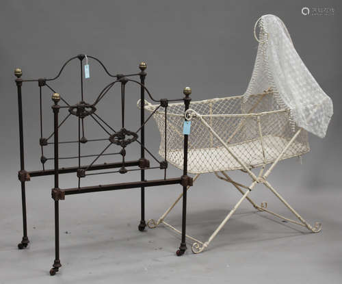 A Victorian cast iron and brass mounted child's bed, width 76cm, together with a Victorian white