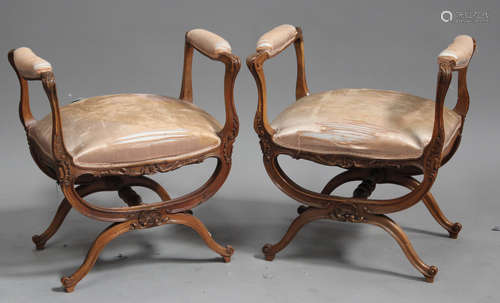 A pair of late 19th century French walnut framed window seats, the upholstered armrests and seats