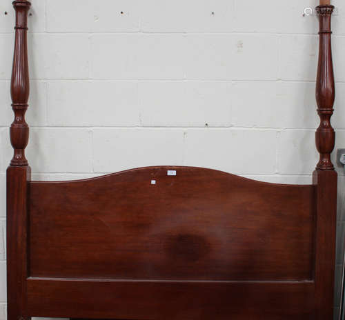 A modern reproduction mahogany framed four poster double bed, width 150cm.Buyer’s Premium 29.4% (