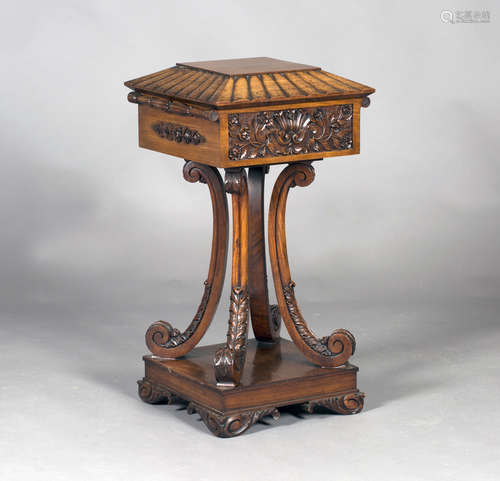 A Regency period rosewood teapoy, possibly Colonial, the lobed hinged lid enclosing four removable