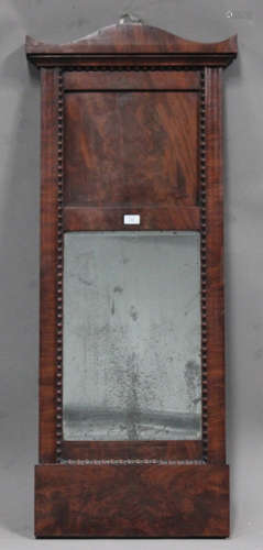 A mid-19th century figured mahogany pier mirror, possibly Channel Islands, the bevelled plate