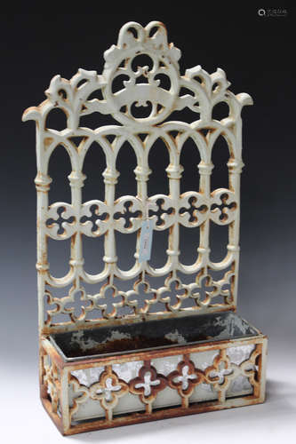 A 20th century Gothic style cast metal wall mounted garden planter with a pierced backplate and