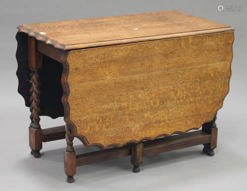 A George V oak gateleg table, raised on barleytwist legs, height 74.5cm, length 161cm, depth 106cm.