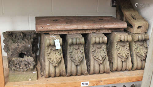 A group of 19th century Coade type moulded composition stone architectural elements, comprising a