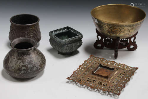 A small group of Eastern brassware, including an Indian bowl worked with floral boteh, other bowls