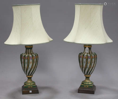 A pair of 20th century Continental porcelain and brass mounted table lamps, the shaped ovoid