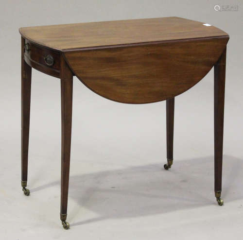 A late 19th century mahogany oval Pembroke table, fitted with a single frieze drawer and opposing