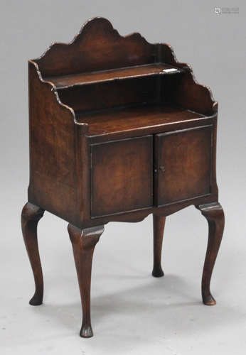 A 20th century walnut bedside cabinet, fitted with a shelf above a cupboard, height 83cm, width