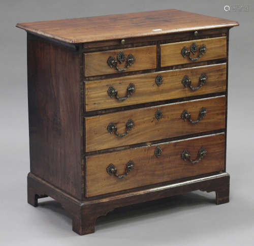 A George III mahogany bachelor's chest, the brushing slide above two short and three long drawers,