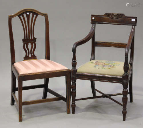 A Regency mahogany bar back armchair with fluted decoration, the downswept arms above a drop-in seat