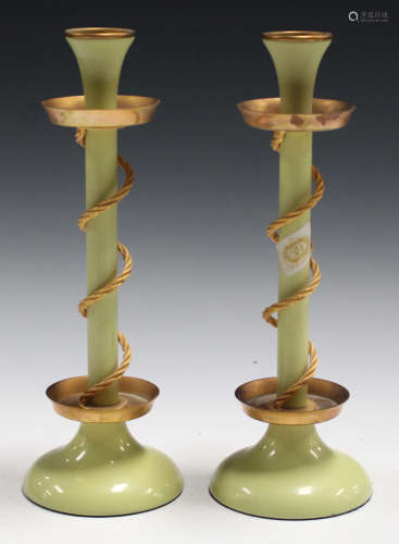 A pair of 20th century Bilston enamel candlesticks of lime green colouring, the gilt metal drip