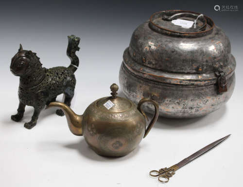 A small group of Islamic metalware, including a travelling pot, a pierced bronze model of a lion,