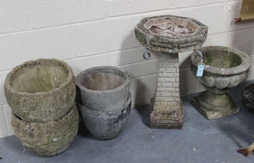 A 20th century cast composition stone garden birdbath, raised on a brick effect pedestal, height