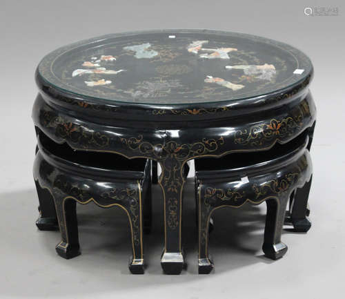 A 20th century Chinese black lacquered nest of tables, height 47cm, width 77cm.Buyer’s Premium 29.4%