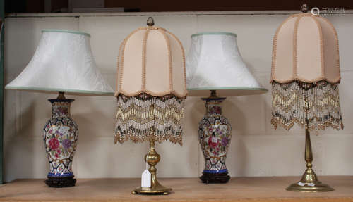 Two 19th century brass candlesticks, converted to table lamps and fitted with domed shades hung with