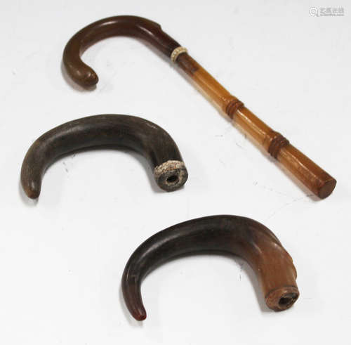 Two 19th century rhino horn walking stick handles of curved form, lengths 11cm, total weight 122g,