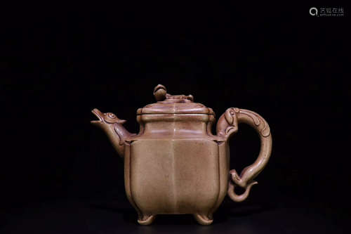 A THREE-BEAST DESIGN PURPLE CLAY TEAPOT