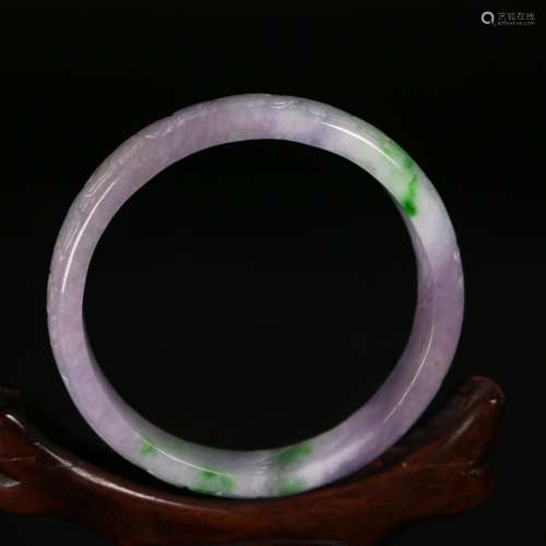 A Chinese Carved Jadeite Bangle