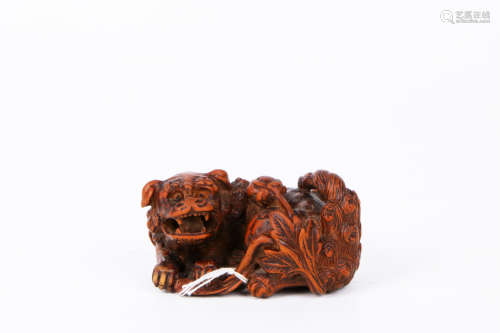 A chinese boxwood lion decoration