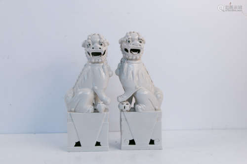 A pair of white porcelain statues