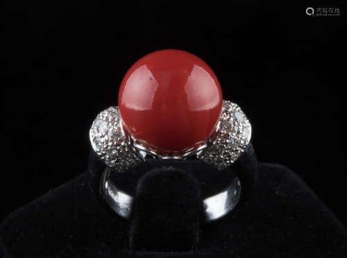 Red ball coral ring. Diamond decoration