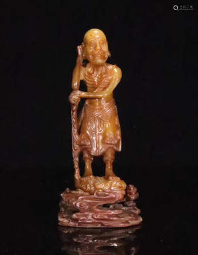 A TIANHUANG SOAPSTONE CARVED LUOHAN FIGURE