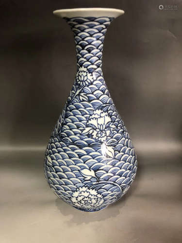 A BLUE WAVE AND FLORAL PATTERN PEAR-SHAPE VASE