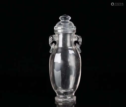 A CRYSTAL CARVED BOTTLE VASE