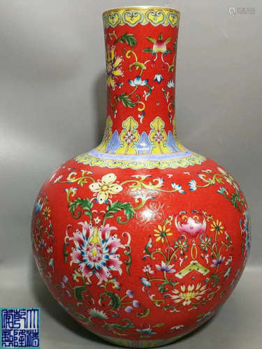 A RED-GROUND YANGCAI FLORAL PATTERN VASE