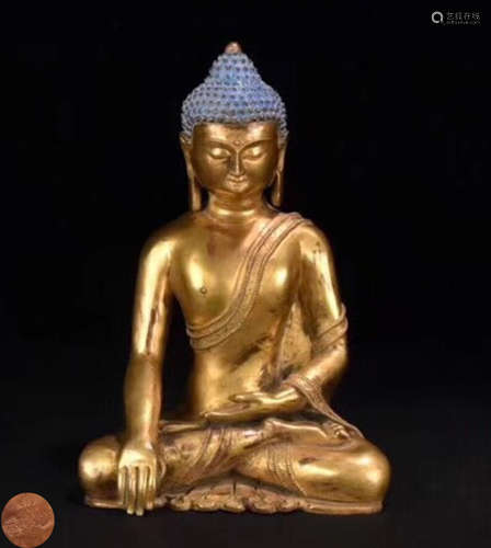 A GILT BRONZE MOLDED SAKYAMUNI BUDDHA STATUE