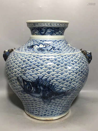 A BLUE AND WHITE FISH AND WAVE PATTERN JAR