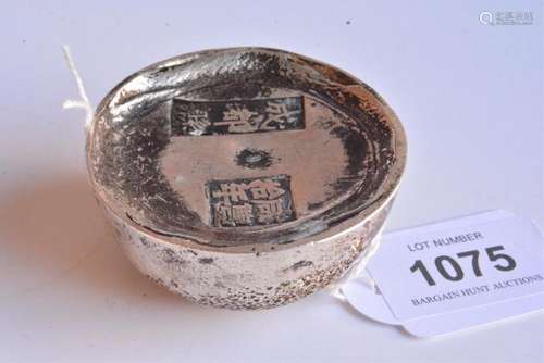 Chinese silver coloured circular ingot,