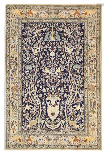 AN EXTREMELY FINE PART SILK ISFAHAN RUG, CENTRAL PERSIA approx: 5ft.4in. x 3ft.6in.(163cm. x 107cm.) This rug has full pile, fine kurk wool quality and part silk. Very good design with flowering vase, trees, animals and birds. Colours are well blended. Extremely fine weave, approx: 10 x 10 knots per sq. cm. ends original with tiny wear on the edge of the kilim, Selvages are also original. In general this rug is in very good condition throughout, ca.1950's