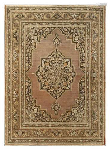 AN ANTIQUE TABRIZ RUG, NORTH-WEST PERSIA approx: 5ft.8in. x 4ft.1in.(173cm. x 124cm.) Classic design for this type. The pile has slight localized wear. Cotton flat selvages original. Ends with short fringes. Bold appearance. Attractive.